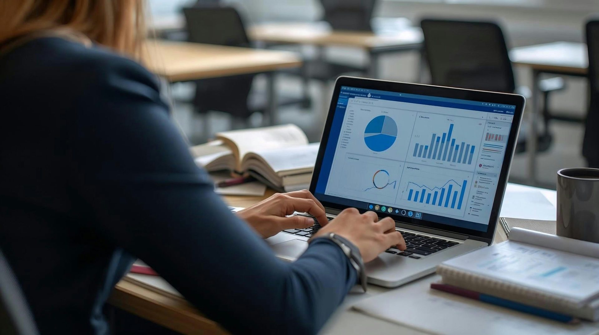 Consultant working with an Odoo dashboard on her laptop